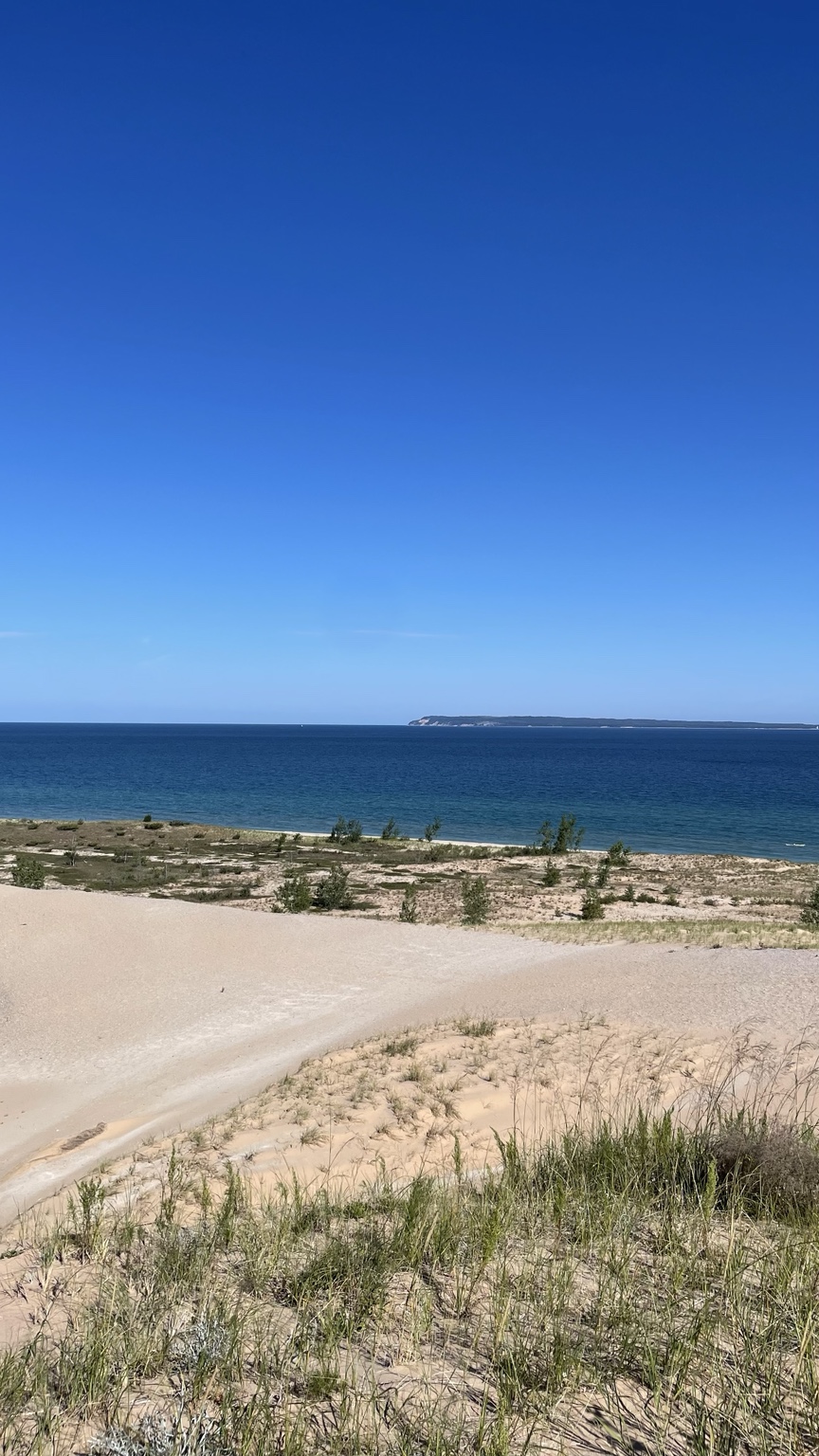 Lake Michigan seen beyond grass-covered dunes